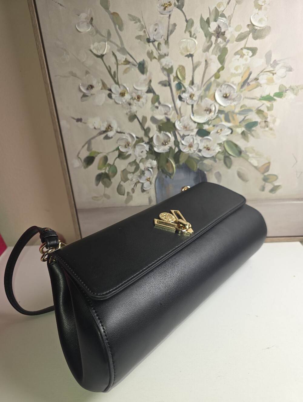 Elegant Black Leather Clutch with Gold Accent